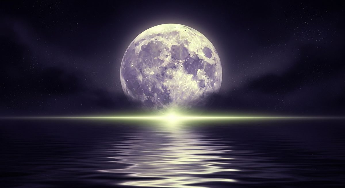 A moon low over still water
